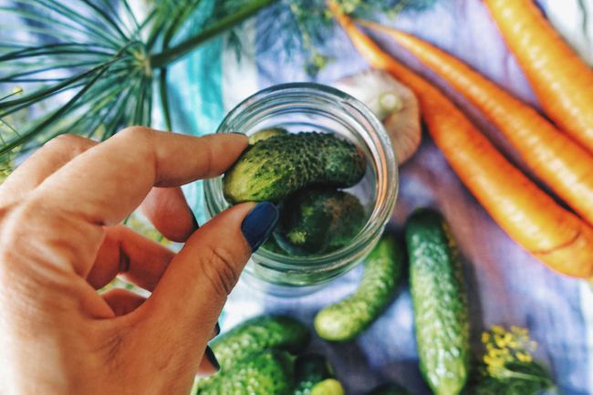Portrait of Cropped Hand Making Pickles